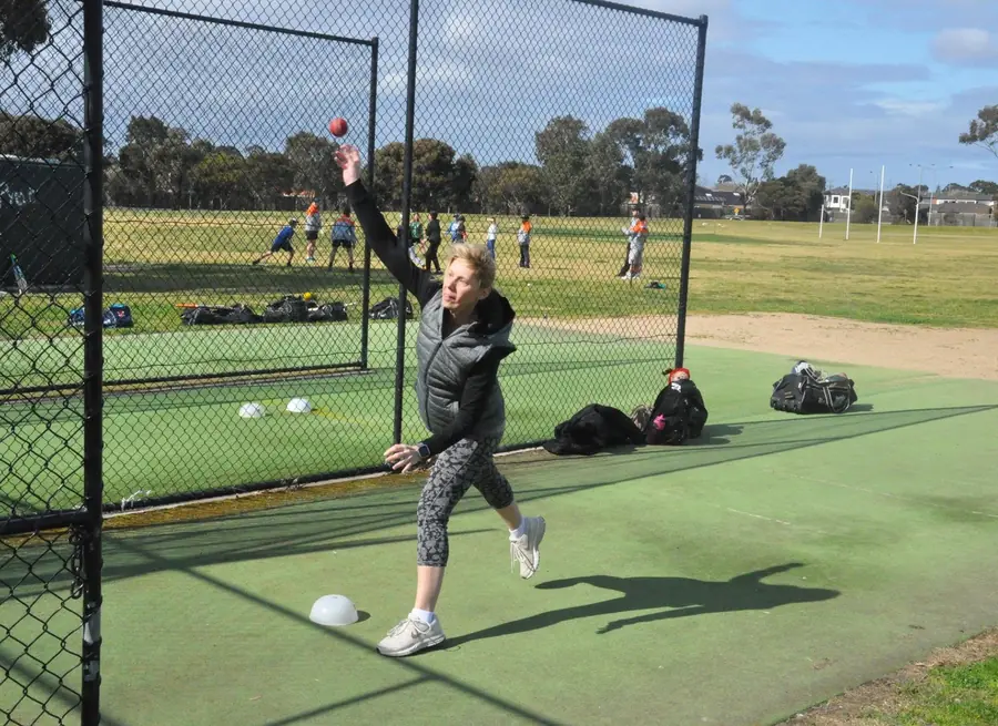 A Keilor Park women's player bowling in the nets at Keilor Park